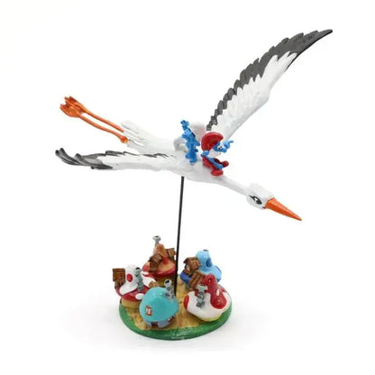 Figurine Pixi Les Schtroumpfs à dos de cigogne survolant le village, métal peint à la main dessus avant