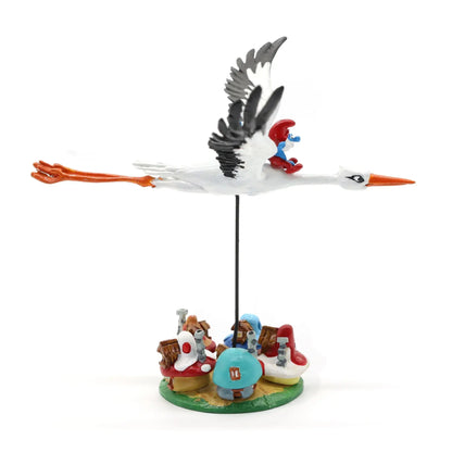 Figurine Pixi Les Schtroumpfs à dos de cigogne survolant le village, métal peint à la main profil droit